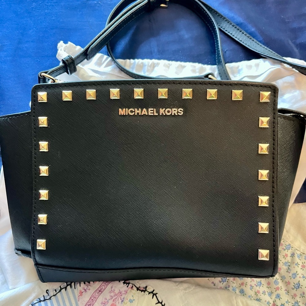Small Michael Kors, black purse with gold studs lightly used no damage